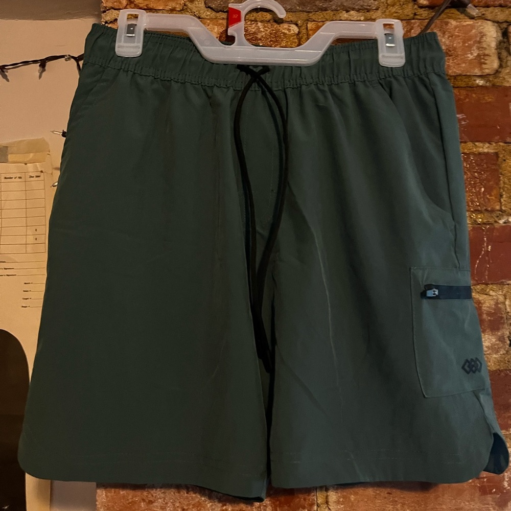 Brand new green athletic shorts, small